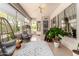 Relaxing sunroom featuring large windows, comfortable seating, and a peaceful ambiance at 5372 S Cat Claw Dr, Gold Canyon, AZ 85118