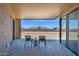 Inviting covered back patio with tile flooring and views of the spacious backyard at 553 W Cavalry Rd, New River, AZ 85087
