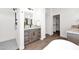 Modern bathroom features walk-in shower, double vanity and separate toilet room at 553 W Cavalry Rd, New River, AZ 85087