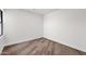 Empty bedroom showcasing light vinyl flooring, white walls, and bright, natural light at 553 W Cavalry Rd, New River, AZ 85087