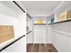 Customized walk-in closet providing generous storage, and organized shelving at 553 W Cavalry Rd, New River, AZ 85087