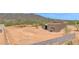 Contemporary home with a neutral stucco exterior, set against a desert landscape at 553 W Cavalry Rd, New River, AZ 85087