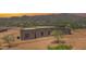 Desert home featuring stucco exterior, mountain views, and drought-tolerant landscaping at 553 W Cavalry Rd, New River, AZ 85087