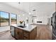 Bright, open floor plan connecting kitchen and living area, showcasing modern design and ample natural light at 553 W Cavalry Rd, New River, AZ 85087