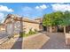 Charming single-story home with desert landscaping, a two-car garage, and a tile roof at 5734 W Commonwealth Pl, Chandler, AZ 85226