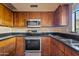 Well-appointed kitchen featuring stainless steel appliances and granite countertops at 5734 W Commonwealth Pl, Chandler, AZ 85226