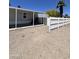 Backyard view of a single-story home featuring a covered porch and fenced-in yard at 625 W Mckellips Rd # 325, Mesa, AZ 85201