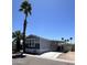 Charming single-story home with carport and well-manicured landscaping at 625 W Mckellips Rd # 325, Mesa, AZ 85201