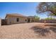 Expansive backyard with a fountain, perfect for relaxation and outdoor gatherings at 664 W Silver Reef Ct, Casa Grande, AZ 85122