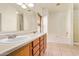 Bathroom featuring a soaking tub, shower, and dual sink vanity at 664 W Silver Reef Ct, Casa Grande, AZ 85122