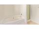 Clean bathroom featuring a soaking tub and glass-enclosed shower at 664 W Silver Reef Ct, Casa Grande, AZ 85122