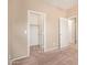 Neutral bedroom with a closet and connecting door offering versatile space at 664 W Silver Reef Ct, Casa Grande, AZ 85122