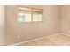 A carpeted bedroom with a window that allows lots of natural light at 664 W Silver Reef Ct, Casa Grande, AZ 85122