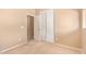 Neutral-toned bedroom with an open closet and carpet flooring at 664 W Silver Reef Ct, Casa Grande, AZ 85122