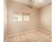 A carpeted bedroom with a window that allows lots of natural light at 664 W Silver Reef Ct, Casa Grande, AZ 85122