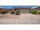 Charming single-story home featuring a well-maintained yard and two-car garage at 664 W Silver Reef Ct, Casa Grande, AZ 85122