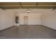 Spacious two-car garage offering ample parking and storage with a clean epoxy floor at 664 W Silver Reef Ct, Casa Grande, AZ 85122