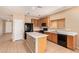 Spacious kitchen features a large island, black appliances, plenty of cabinets, and tiled flooring at 664 W Silver Reef Ct, Casa Grande, AZ 85122