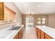 Bright kitchen with modern appliances, a center island, and a sink overlooking the backyard at 664 W Silver Reef Ct, Casa Grande, AZ 85122