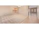 Open living space with neutral carpet and tile flooring at 664 W Silver Reef Ct, Casa Grande, AZ 85122