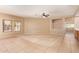 Spacious living room featuring neutral walls, tile flooring, carpet accent and lots of natural light at 664 W Silver Reef Ct, Casa Grande, AZ 85122
