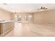 Open living space with neutral carpet and tile flooring at 664 W Silver Reef Ct, Casa Grande, AZ 85122