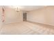 Open living space with neutral carpet and tile flooring at 664 W Silver Reef Ct, Casa Grande, AZ 85122