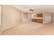 Bright living room boasts neutral walls, tile flooring with carpet accent, and a convenient wet bar at 664 W Silver Reef Ct, Casa Grande, AZ 85122