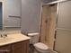 Standard bathroom features a toilet, sink, mirror, and enclosed shower at 6904 E Trailridge Cir, Mesa, AZ 85207
