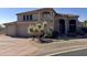Expansive front yard featuring a lush desert plant and a paver driveway that leads to the home's entrance at 6904 E Trailridge Cir, Mesa, AZ 85207
