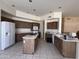 Spacious kitchen with tiled floors, center island and lots of cabinet space at 6904 E Trailridge Cir, Mesa, AZ 85207