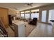 Spacious living room with large windows and ceiling fans provides ample natural light at 6904 E Trailridge Cir, Mesa, AZ 85207