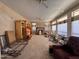 Open Living Room with beamed ceiling, ceiling fan, and lots of windows at 6904 E Trailridge Cir, Mesa, AZ 85207