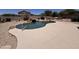 Backyard pool with waterfall feature offers a refreshing oasis for outdoor living at 6904 E Trailridge Cir, Mesa, AZ 85207