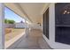 A long shaded back porch with a shed and backyard visible at 7008 W Sierra St, Peoria, AZ 85345