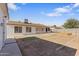 Backyard featuring a porch, garden beds, and ample space for landscaping at 7008 W Sierra St, Peoria, AZ 85345