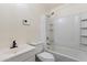 Cozy bathroom equipped with a shower-tub combo, toilet, and sleek vanity at 7008 W Sierra St, Peoria, AZ 85345
