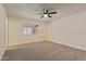 Bright bedroom with a ceiling fan and a window letting in natural light at 7008 W Sierra St, Peoria, AZ 85345