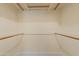 A walk-in closet with built in shelving for plenty of storage at 7008 W Sierra St, Peoria, AZ 85345