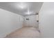 Unfinished storage room with concrete floors and overhead lighting at 7008 W Sierra St, Peoria, AZ 85345