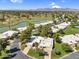 Aerial shot of a residential area featuring houses near a lake, golf course, and mountain views at 7832 E Via Marina --, Scottsdale, AZ 85258