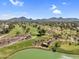 Expansive aerial view capturing the green golf course and lake, perfect for avid golfers at 7832 E Via Marina --, Scottsdale, AZ 85258