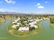Panoramic aerial view of a lakeside community offering a peaceful setting and lush green surroundings at 7832 E Via Marina --, Scottsdale, AZ 85258