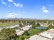 Scenic aerial view of the community featuring lush landscaping, golf course, and distant mountain views at 7832 E Via Marina --, Scottsdale, AZ 85258