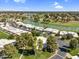Expansive aerial shot showcasing the community's homes nestled around a beautiful lake and golf course at 7832 E Via Marina --, Scottsdale, AZ 85258