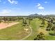 Picturesque aerial view capturing a golf course and walking paths amidst lush greenery at 7832 E Via Marina --, Scottsdale, AZ 85258