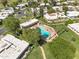 Aerial view showing a community pool surrounded by palm trees, lush landscaping, and walking paths at 7832 E Via Marina --, Scottsdale, AZ 85258