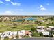 Gorgeous aerial view of homes with a beautiful lake, golf course, and mature trees within the community at 7832 E Via Marina --, Scottsdale, AZ 85258