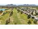 Scenic aerial view of a golf course community with lush green fairways and mountain views in the distance at 7832 E Via Marina --, Scottsdale, AZ 85258