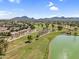 Breathtaking aerial view of a lush golf course alongside a serene lake in a desert community at 7832 E Via Marina --, Scottsdale, AZ 85258